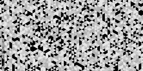Abstract geometric pattern composed of interlocking triangles shapes, rendered in a monochrome black, white, and gray palette, the design features sharp angles modern, minimalist background.