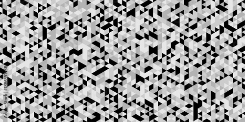 Abstract geometric pattern composed of interlocking triangles shapes, rendered in a monochrome black, white, and gray palette, the design features sharp angles modern, minimalist background.