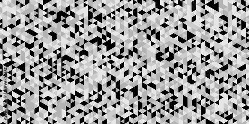 Abstract geometric pattern composed of interlocking triangles shapes, rendered in a monochrome black, white, and gray palette, the design features sharp angles modern, minimalist background.