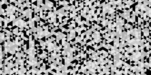 Abstract geometric pattern composed of interlocking triangles shapes, rendered in a monochrome black, white, and gray palette, the design features sharp angles modern, minimalist background.