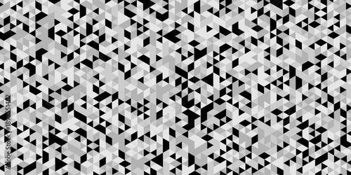 Abstract geometric pattern composed of interlocking triangles shapes, rendered in a monochrome black, white, and gray palette, the design features sharp angles modern, minimalist background.