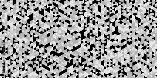 Abstract geometric pattern composed of interlocking triangles shapes, rendered in a monochrome black, white, and gray palette, the design features sharp angles modern, minimalist background.