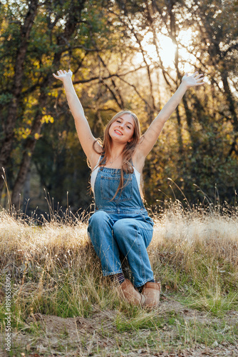 happy girl in sunlit woods