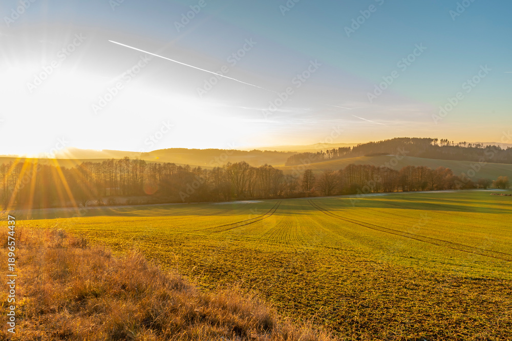 Obraz premium colorful winter evening with sunset on fields