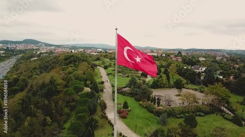 Turkish flag on the top of the hills of Istanbul. Aerial footage of the Turkish flag waving in the Bosphorus. The first bridge connecting the continents of Asia and Europe.
