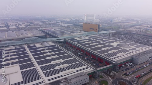 Aerial view of fiera milano exhibition center with solar panels on roof