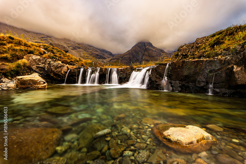 Wallpaper Mural Fairy Pools waterfalls on the Isle of Skye, Scotland, with clear mountain water, rocky stream and dramatic clouds over Cuillin mountains, iconic Scottish landscape and nature scene Torontodigital.ca