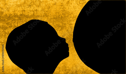 Child silhouette connecting with a pregnant belly, symbolizing new life and family bonding against gold texture