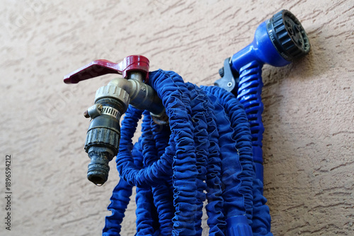Outdoor tap for watering a garden plot. Water tap outside the building