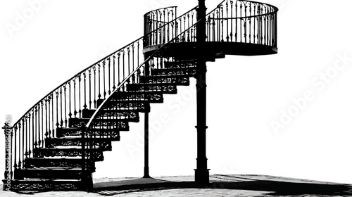 A winding outdoor staircase with intricate railings. It is a spiral structure, dark against the background