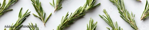Rosemary Sprigs on White Surface: Culinary Herb for Cooking and Garnish
