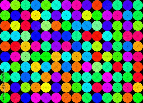 Multi colored spoked circles on a black background in 7 x 5 aspect ratio.