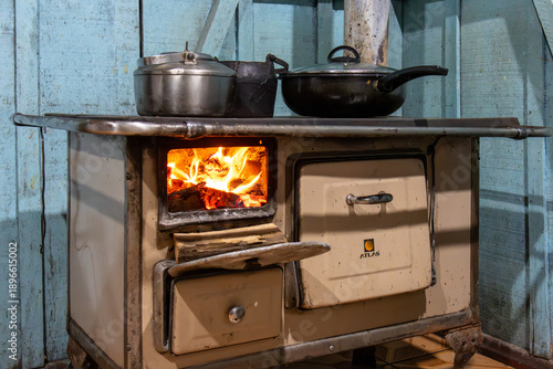 Traditional vintage wood burning stove with pots and kettle in a rustic kitchen in Florestopolis Brazil