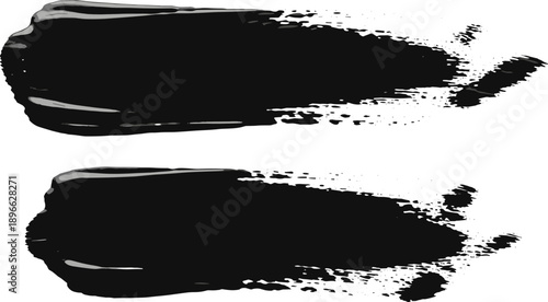 Two black brush strokes on a clean surface viewed from a straightforward perspective