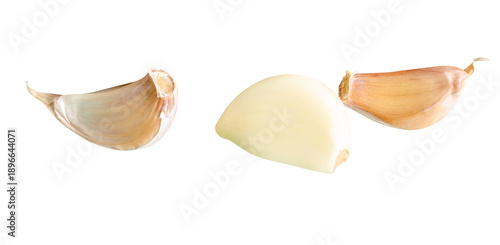 Side view set of three garlic cloves in heap isolated with clipping path in png file format