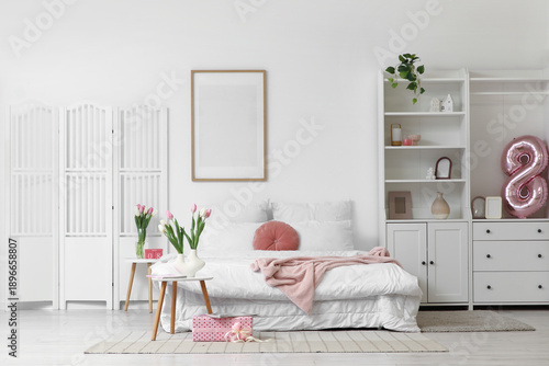Interior of light bedroom w...