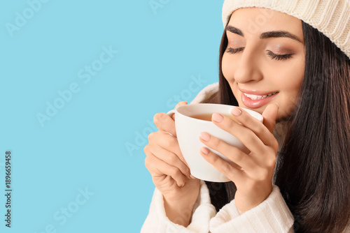 Happy young woman in winter...