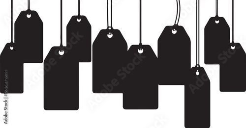 Black price tags hanging on strings in a row