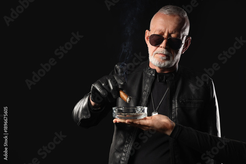 Stylish old man in leather ...