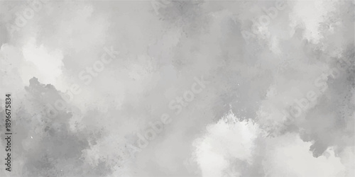 A dark and moody nature background of white fog and blue mist drifting through mountains under a stormy cloudscape with a motion texture of smoke and light