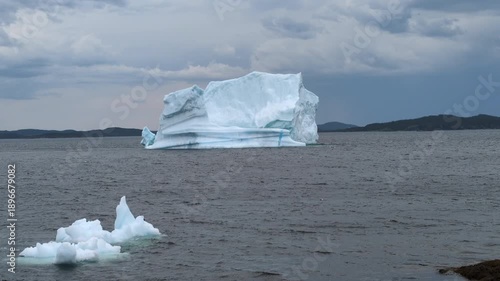 A large iceberg floating and melting in Gillot Cove at Twillingate (Newfoundland, Canada)