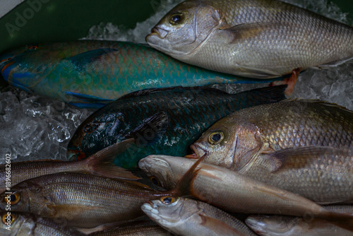 Fresh silver and blue fish at a Japanese market. Healthy eating and wholesome products. Close-up.