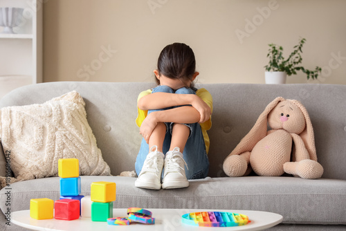 Sad girl with autistic diso...