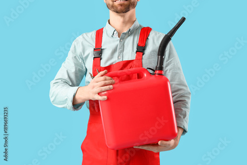 Male mechanic with canister...