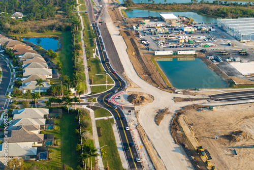 Wallpaper Mural Driving traffic cars at roundabout intersection under construction. Building traffic circle on American road with moving cars Torontodigital.ca