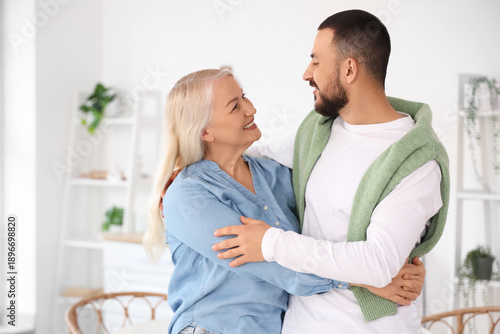 Young man hugging his mothe...