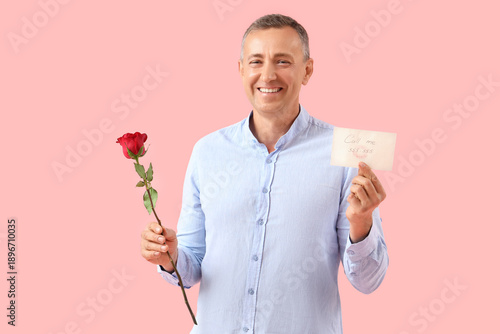 Happy mature man with rose ...