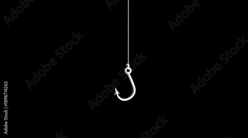 Shiny metallic fishing hook on a line against a solid black background, concept for angling, bait, danger, or capture