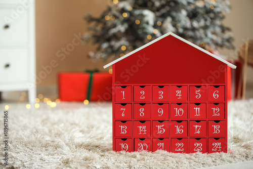 Red advent calendar on floo...