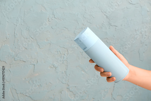 Female hand with spray pain...