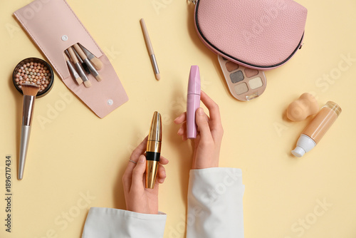Female hands with mascara a...