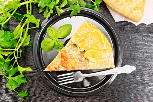 Galette with minced meat and peppers in plate on board top