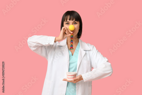 Funny young female dentist ...