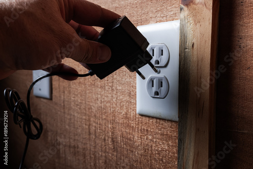 Canvas Print The literal mismatch between a European Type C power plug and a North American Type B wall outlet