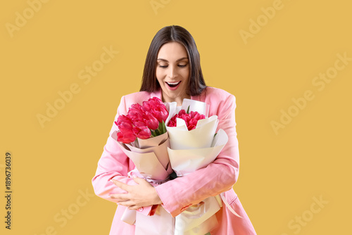 Young woman with bouquets o...