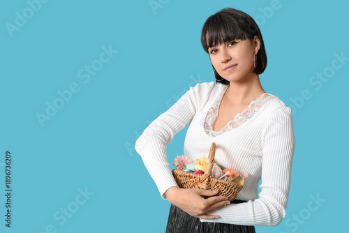 Pretty young woman holding ...