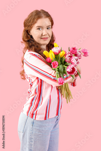 Young woman with bouquet of...