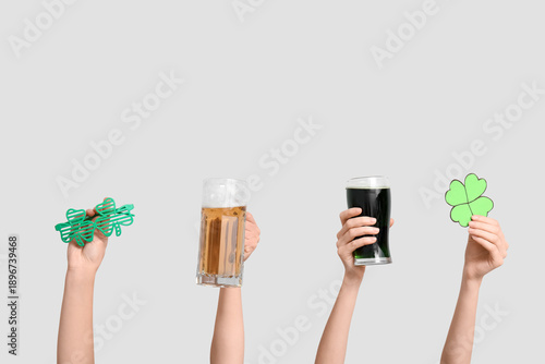 Hands with beer, clover and...