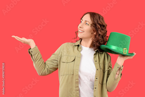 Woman with green hat showin...