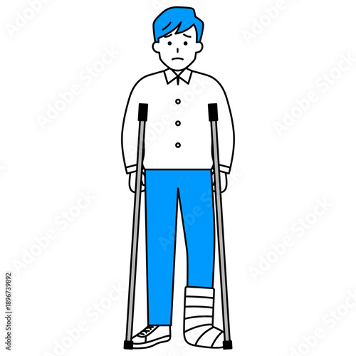 足を怪我して松葉杖をついている若い男性