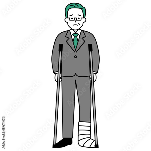 足を怪我して松葉杖をついている中年のスーツの男性