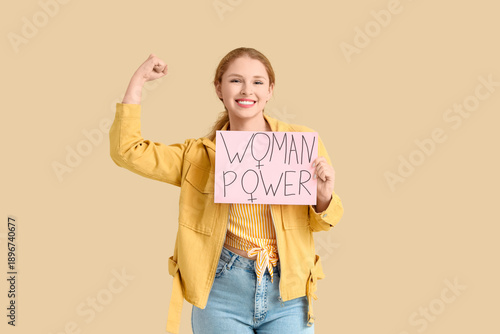 Young girl holding paper wi...