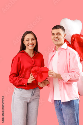 Young couple with gift and ...