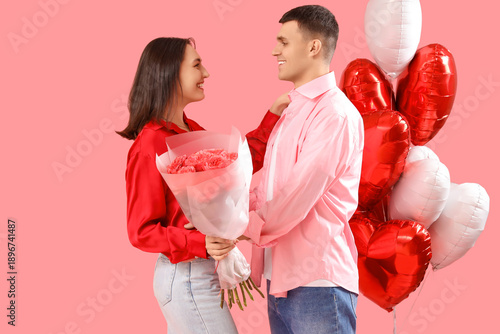 Young couple with roses and...