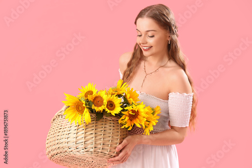 Young woman with basket of ...