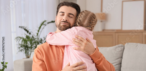 Cute little girl hugging he...